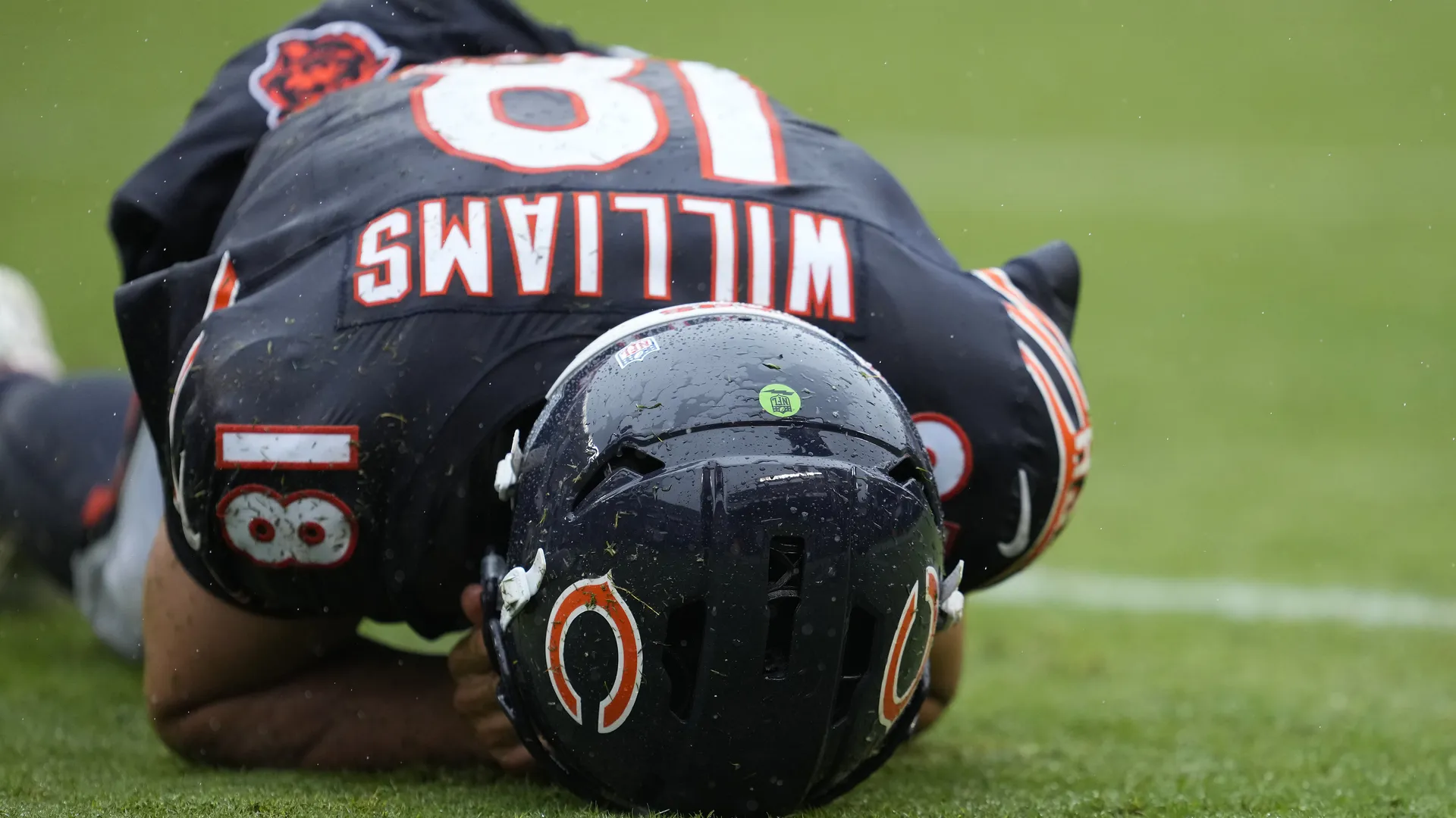 Caleb Williams down on the Soldier Field turf against Minnesota